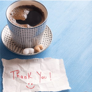 Coffee cup with hand written thank you note